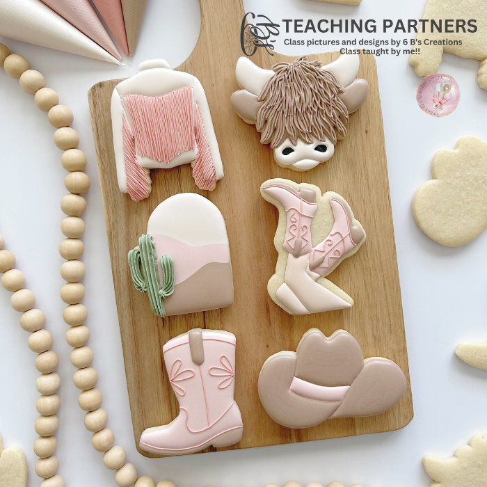 Students learning cookie decorating techniques in hands-on classes with professional instruction