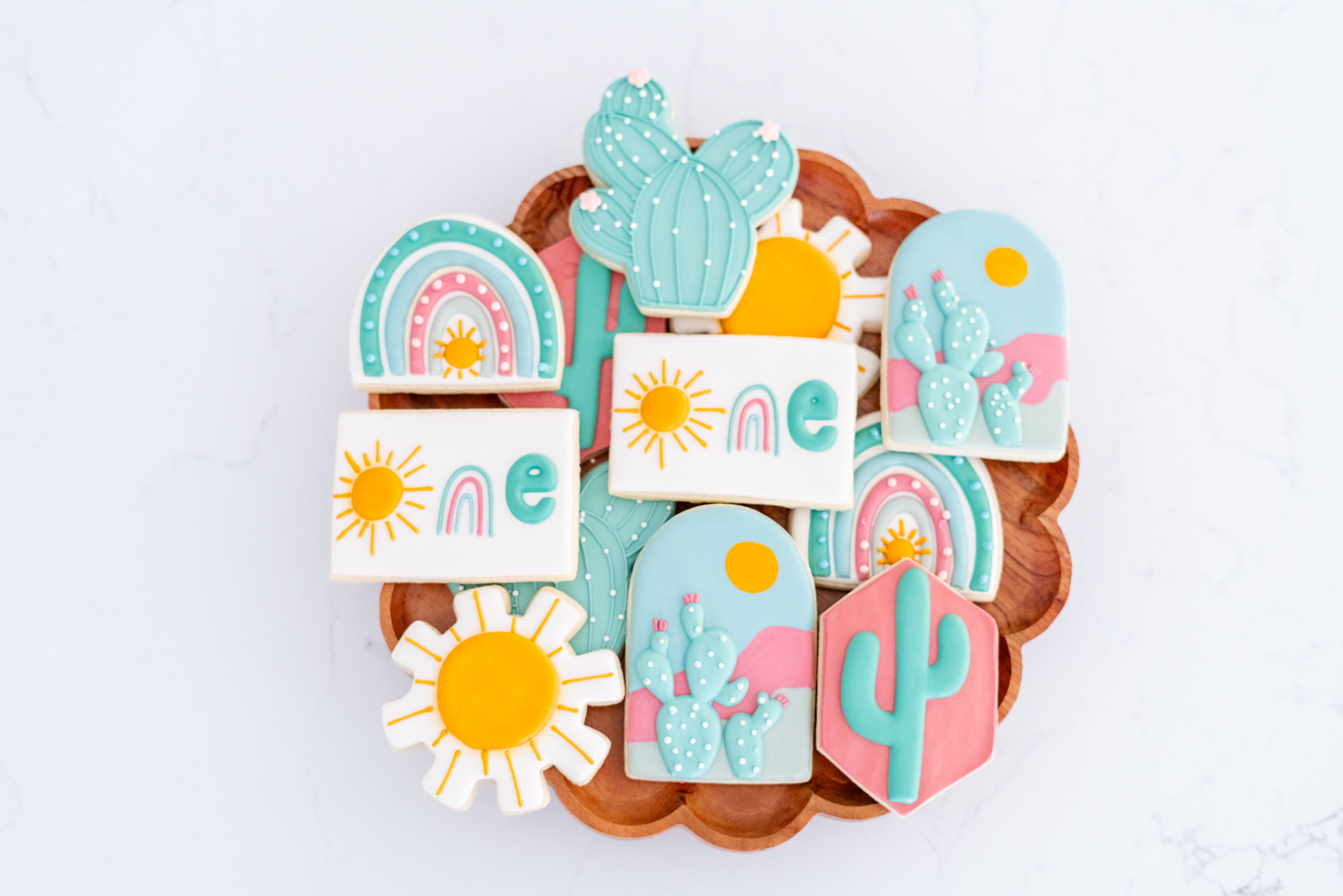 Elegant custom decorated cookies with floral designs and gold details